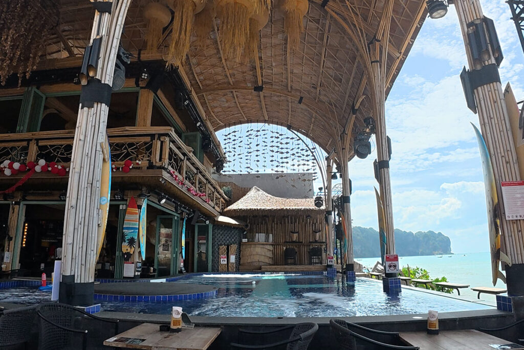 Large bamboo arched pavilion with an infinity pool overlooking the sea at Bamboo Beach Club, Ao Nang